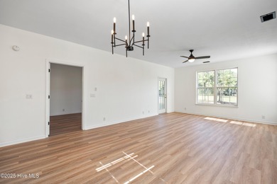 TASTEFULLY REMODELLED 10/1/2025,,,This charming condo with on Sandpiper Bay Golf and Country Club in North Carolina - for sale on GolfHomes.com, golf home, golf lot