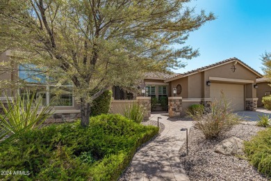 Luxury meets tranquility in this stunning David Weekley home on Estrella Mountain Ranch Golf Course in Arizona - for sale on GolfHomes.com, golf home, golf lot