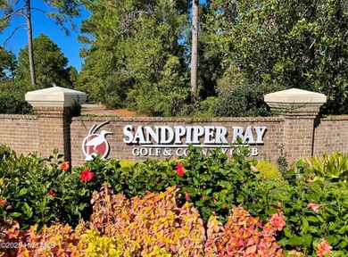 TASTEFULLY REMODELLED 10/1/2025,,,This charming condo with on Sandpiper Bay Golf and Country Club in North Carolina - for sale on GolfHomes.com, golf home, golf lot