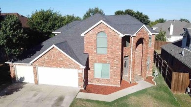 This spacious family home offers the perfect blend of comfort on Eagle Mountain Country Club  in Texas - for sale on GolfHomes.com, golf home, golf lot