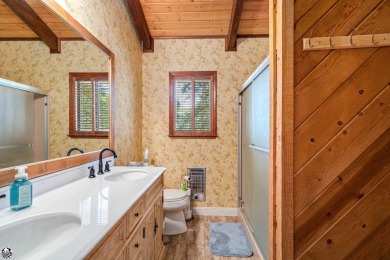 Relax and stay in this charming 3-bedroom, 2-bath cabin nestled on Pine Mountain Lake Country Club in California - for sale on GolfHomes.com, golf home, golf lot