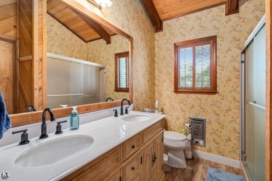 Relax and stay in this charming 3-bedroom, 2-bath cabin nestled on Pine Mountain Lake Country Club in California - for sale on GolfHomes.com, golf home, golf lot