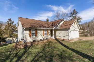 Welcome to the lake! This one is a turnkey waterfront lake house on Raintree Country Club in Missouri - for sale on GolfHomes.com, golf home, golf lot