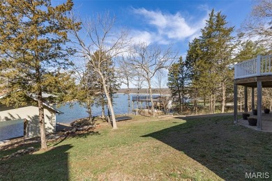 Welcome to the lake! This one is a turnkey waterfront lake house on Raintree Country Club in Missouri - for sale on GolfHomes.com, golf home, golf lot