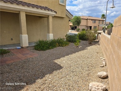 Discover this stunning two-story home nestled in the prestigious on Rhodes Ranch Golf Club in Nevada - for sale on GolfHomes.com, golf home, golf lot