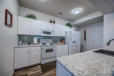 Top-Floor Palisades Condo with Main Channel Views! Enjoy on Tan-Tar-A Golf Club in Missouri - for sale on GolfHomes.com, golf home, golf lot