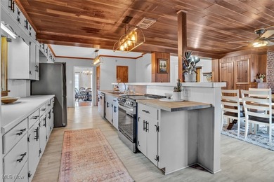 Here's your chance to own two distinctive homes on one on Alliance Country Club in Ohio - for sale on GolfHomes.com, golf home, golf lot