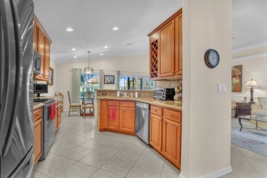 RARELY AVAILABLE EXTENDED GENOVA MODEL SET ON A BEAUTIFUL CANAL on Westchester Golf and Country Club in Florida - for sale on GolfHomes.com, golf home, golf lot