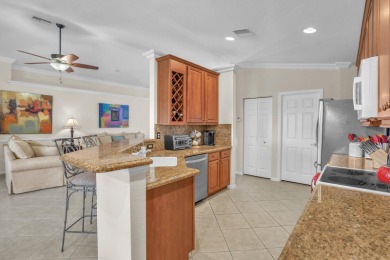 RARELY AVAILABLE EXTENDED GENOVA MODEL SET ON A BEAUTIFUL CANAL on Westchester Golf and Country Club in Florida - for sale on GolfHomes.com, golf home, golf lot
