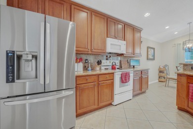 RARELY AVAILABLE EXTENDED GENOVA MODEL SET ON A BEAUTIFUL CANAL on Westchester Golf and Country Club in Florida - for sale on GolfHomes.com, golf home, golf lot
