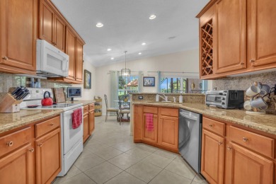 RARELY AVAILABLE EXTENDED GENOVA MODEL SET ON A BEAUTIFUL CANAL on Westchester Golf and Country Club in Florida - for sale on GolfHomes.com, golf home, golf lot