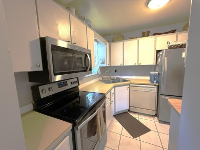 Lowest priced 1BR, 1.5BA 55+ condo with unlimited golf and on Monterey Yacht and Country Club in Florida - for sale on GolfHomes.com, golf home, golf lot