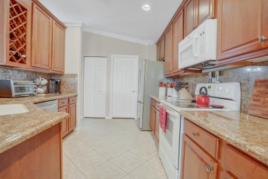 RARELY AVAILABLE EXTENDED GENOVA MODEL SET ON A BEAUTIFUL CANAL on Westchester Golf and Country Club in Florida - for sale on GolfHomes.com, golf home, golf lot