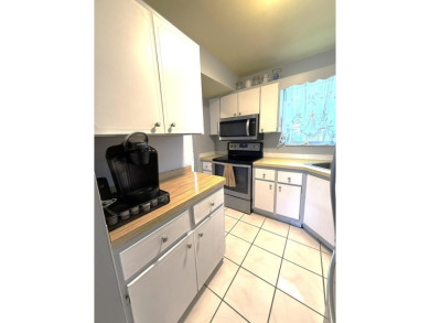 Lowest priced 1BR, 1.5BA 55+ condo with unlimited golf and on Monterey Yacht and Country Club in Florida - for sale on GolfHomes.com, golf home, golf lot
