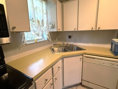 Lowest priced 1BR, 1.5BA 55+ condo with unlimited golf and on Monterey Yacht and Country Club in Florida - for sale on GolfHomes.com, golf home, golf lot