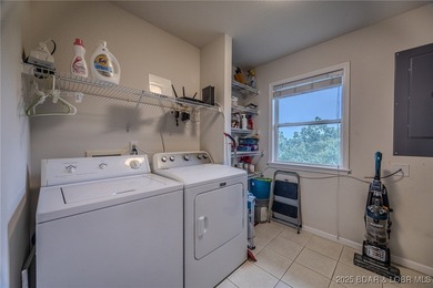 Top-Floor Palisades Condo with Main Channel Views! Enjoy on Tan-Tar-A Golf Club in Missouri - for sale on GolfHomes.com, golf home, golf lot