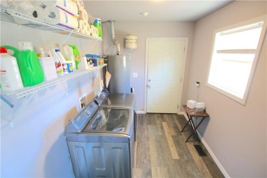 This 4-bedroom, 3.5-bathroom residence is nestled on 1.2 acres on Lost Springs Golf and Athletic Club in Arkansas - for sale on GolfHomes.com, golf home, golf lot