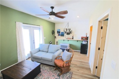 This 4-bedroom, 3.5-bathroom residence is nestled on 1.2 acres on Lost Springs Golf and Athletic Club in Arkansas - for sale on GolfHomes.com, golf home, golf lot