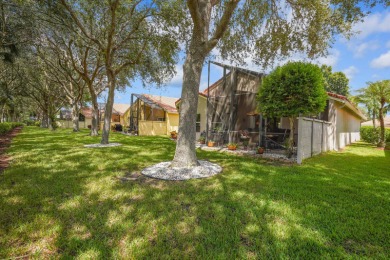 RARELY AVAILABLE EXTENDED GENOVA MODEL SET ON A BEAUTIFUL CANAL on Westchester Golf and Country Club in Florida - for sale on GolfHomes.com, golf home, golf lot