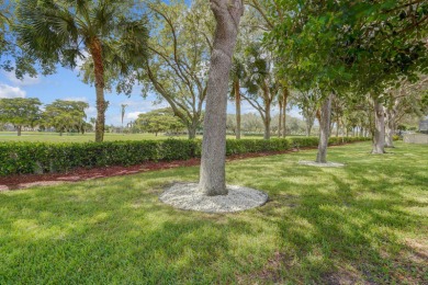 RARELY AVAILABLE EXTENDED GENOVA MODEL SET ON A BEAUTIFUL CANAL on Westchester Golf and Country Club in Florida - for sale on GolfHomes.com, golf home, golf lot