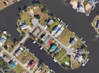 Discover a rare opportunity to own a cleared, waterfront lot on on Pass Christian Isles Golf Club in Mississippi - for sale on GolfHomes.com, golf home, golf lot