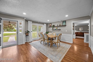 Discover this inviting brick ranch nestled on a serene .48-acre on River Bend Golf and Country Club in North Carolina - for sale on GolfHomes.com, golf home, golf lot