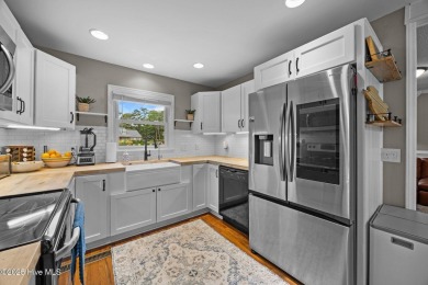 Discover this inviting brick ranch nestled on a serene .48-acre on River Bend Golf and Country Club in North Carolina - for sale on GolfHomes.com, golf home, golf lot
