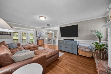 Discover this inviting brick ranch nestled on a serene .48-acre on River Bend Golf and Country Club in North Carolina - for sale on GolfHomes.com, golf home, golf lot