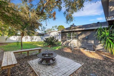 Step inside this meticulously kept, three bedroom, two and a on Baypoint Golf Club in Florida - for sale on GolfHomes.com, golf home, golf lot