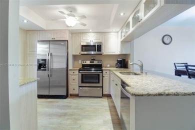 Beautifully renovated 2-bed, 2-bath condo with a modern on Palm-Aire Country Club and Resort - The Oaks in Florida - for sale on GolfHomes.com, golf home, golf lot