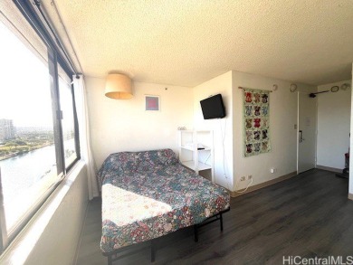 The airy and bright unit overlooking the canal and Ala Wai Golf on Ala Wai Golf Course in Hawaii - for sale on GolfHomes.com, golf home, golf lot