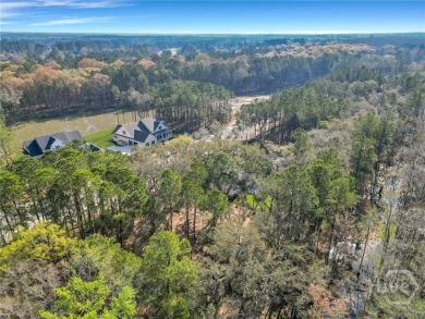 Discover the perfect blend of luxury, privacy, and natural on Savannah Quarters Country Club in Georgia - for sale on GolfHomes.com, golf home, golf lot