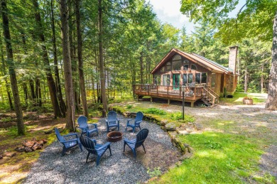 Charming woodsy chalet located just off the back side of the on Hermitage Club Golf Course in Vermont - for sale on GolfHomes.com, golf home, golf lot