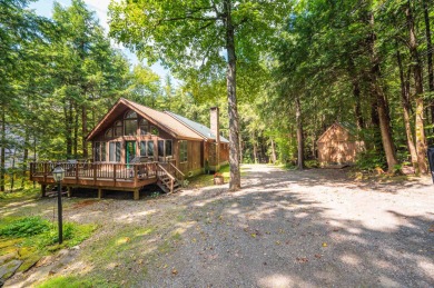 Charming woodsy chalet located just off the back side of the on Hermitage Club Golf Course in Vermont - for sale on GolfHomes.com, golf home, golf lot