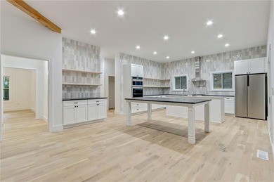 This stunning new construction blends luxury, functionality, and on The Highlands Course at Lake Arrowhead in Georgia - for sale on GolfHomes.com, golf home, golf lot