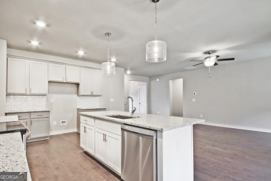 Welcome to 4063 Links Blvd - Built with Heart, Not Just a on Traditions of Braselton Golf Club in Georgia - for sale on GolfHomes.com, golf home, golf lot