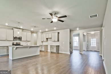 Welcome to 4063 Links Blvd - Built with Heart, Not Just a on Traditions of Braselton Golf Club in Georgia - for sale on GolfHomes.com, golf home, golf lot