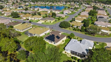 This beautifully maintained, original-owner Madeira model home on Eagle Ridge At Spruce Creek Country Club in Florida - for sale on GolfHomes.com, golf home, golf lot