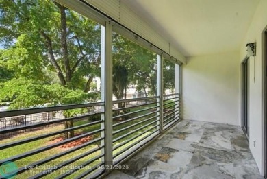 GORGEOUS! COMPLETELY REMODELED 2BEDROOM/2BATH Florida Room on Wynmoor Golf Course in Florida - for sale on GolfHomes.com, golf home, golf lot