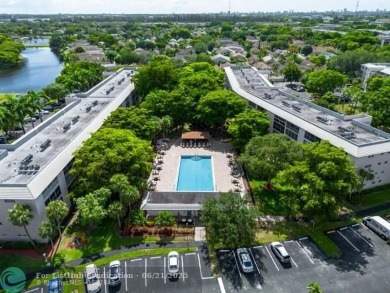 GORGEOUS! COMPLETELY REMODELED 2BEDROOM/2BATH Florida Room on Wynmoor Golf Course in Florida - for sale on GolfHomes.com, golf home, golf lot