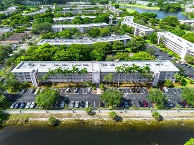 GORGEOUS! COMPLETELY REMODELED 2BEDROOM/2BATH Florida Room on Wynmoor Golf Course in Florida - for sale on GolfHomes.com, golf home, golf lot