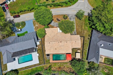 Stunning 4BR/2BA waterfront pool home in prestigious Country on Country Club of Miami in Florida - for sale on GolfHomes.com, golf home, golf lot