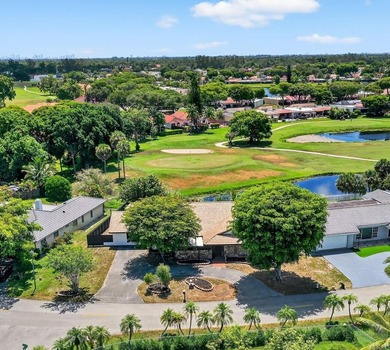 Stunning 4BR/2BA waterfront pool home in prestigious Country on  in Florida - for sale on GolfHomes.com, golf home, golf lot