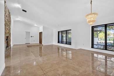 Stunning 4BR/2BA waterfront pool home in prestigious Country on  in Florida - for sale on GolfHomes.com, golf home, golf lot