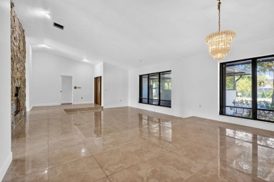 Stunning 4BR/2BA waterfront pool home in prestigious Country on Country Club of Miami in Florida - for sale on GolfHomes.com, golf home, golf lot