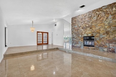 Stunning 4BR/2BA waterfront pool home in prestigious Country on Country Club of Miami in Florida - for sale on GolfHomes.com, golf home, golf lot