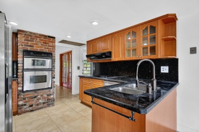 Stunning 4BR/2BA waterfront pool home in prestigious Country on Country Club of Miami in Florida - for sale on GolfHomes.com, golf home, golf lot