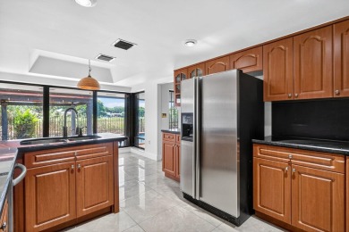 Stunning 4BR/2BA waterfront pool home in prestigious Country on Country Club of Miami in Florida - for sale on GolfHomes.com, golf home, golf lot