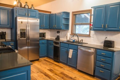 Beautiful getaway in Angel Fire only 1.7 mi from the ski base on Angel Fire Resort Country Club in New Mexico - for sale on GolfHomes.com, golf home, golf lot