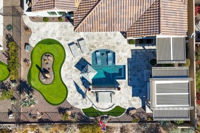 Discover unparalleled luxury in this David Weekley home, located on Verrado Golf Club - Victory in Arizona - for sale on GolfHomes.com, golf home, golf lot